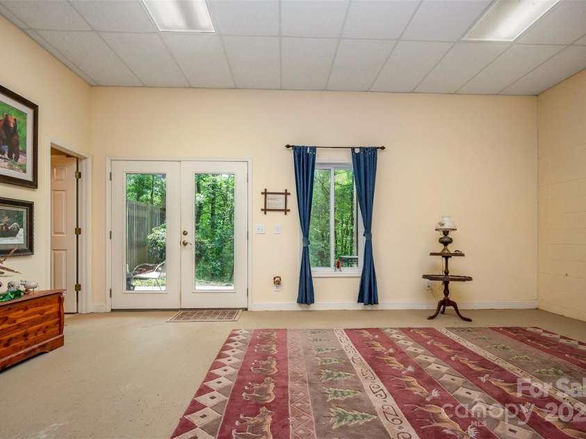 768 White Oak Lane, Tryon, NC 28782.  MLS# CAR4304996, YatesRealty ID 12472. Basement Bedroom