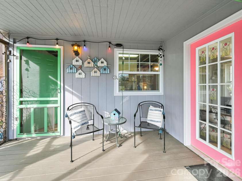 90 Davidson Gap Road, Leicester, NC 28748.  MLS# CAR4368699, YatesRealty ID 12474. Large Porch with French Doors to Living Room and Entrance to Kitchen