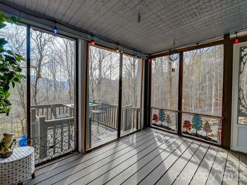 90 Davidson Gap Road, Leicester, NC 28748.  MLS# CAR4368699, YatesRealty ID 12474. Large Screened-In Porch