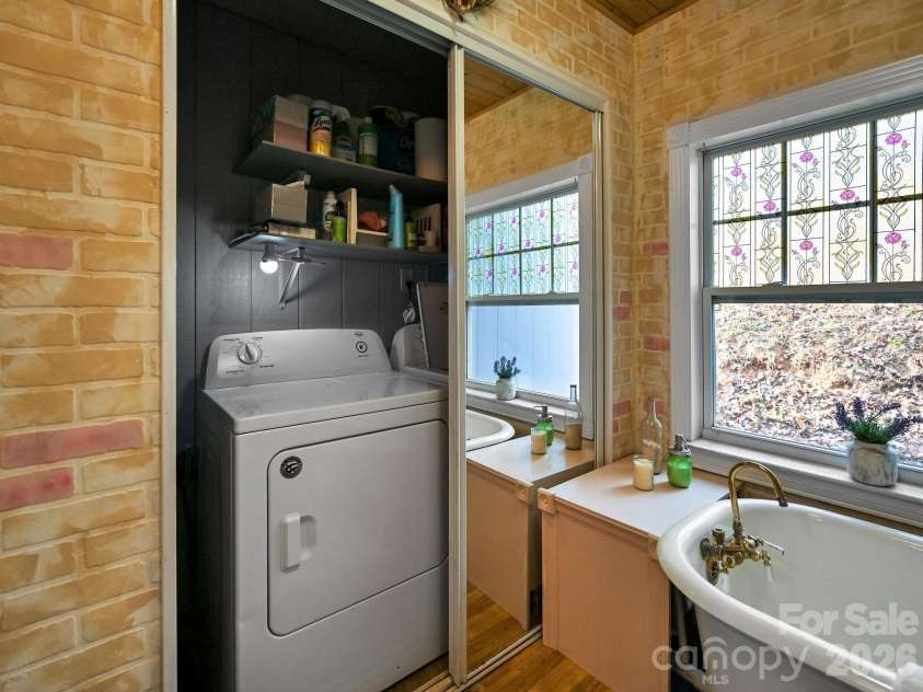 90 Davidson Gap Road, Leicester, NC 28748.  MLS# CAR4368699, YatesRealty ID 12474. Laundry in Primary Bath