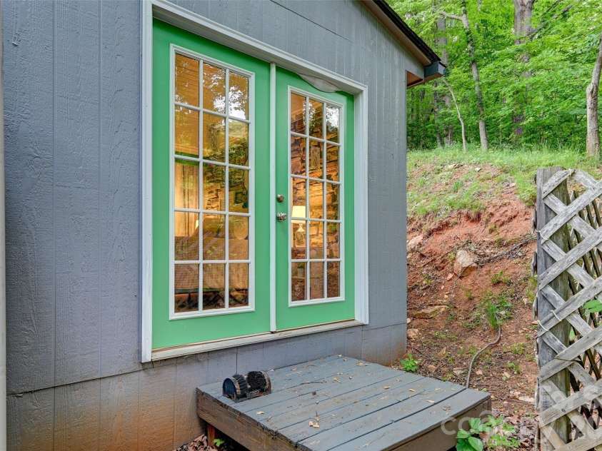 90 Davidson Gap Road, Leicester, NC 28748.  MLS# CAR4368699, YatesRealty ID 12474. Primary Bedroom Entrance in Summer