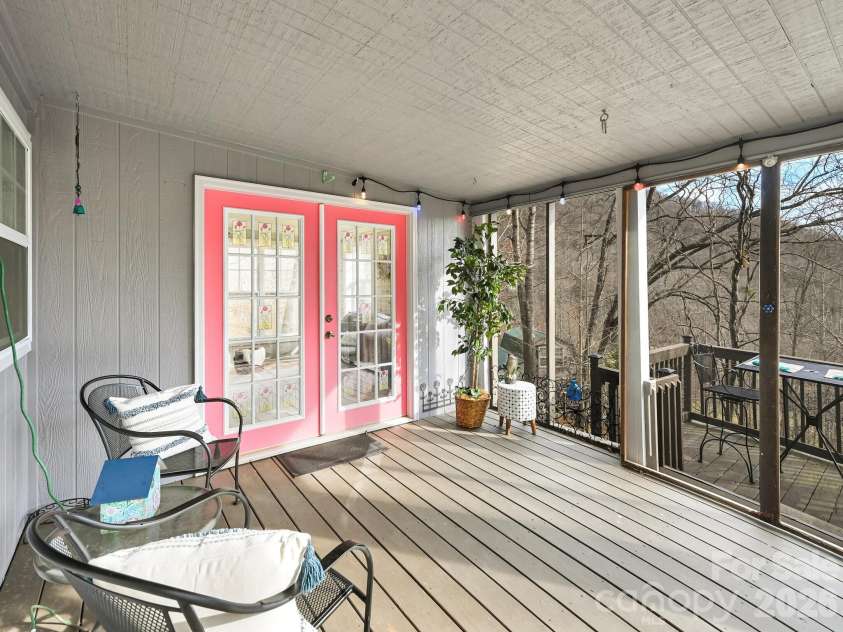 90 Davidson Gap Road, Leicester, NC 28748.  MLS# CAR4368699, YatesRealty ID 12474. Screened-In Porch with French Doors to Living Room