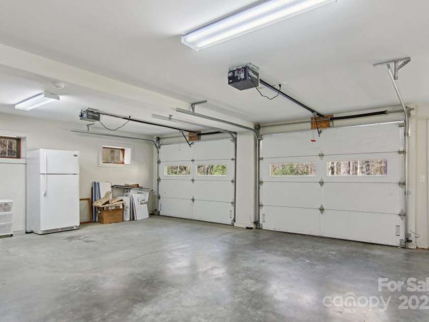 798 Evans Road, Hendersonville, NC 28739.  MLS# CAR4249023, YatesRealty ID 12477. Two car garage w/sink and storage closet