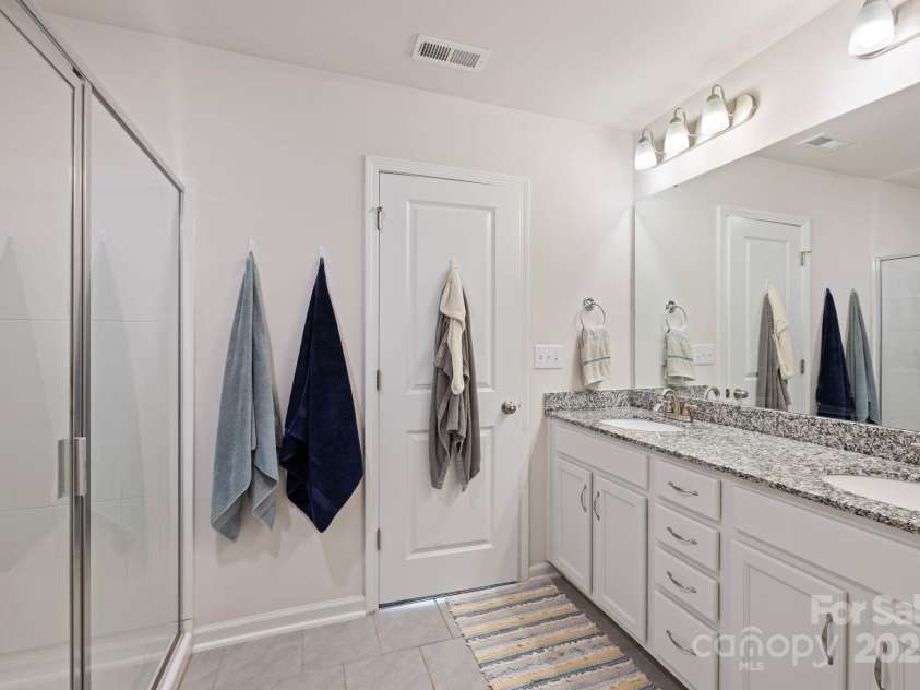 3828 Yorkshire Place, Terrell, NC 28682.  MLS# CAR4250699, YatesRealty ID 12478. Primary Bath- tile flowers/ granite countertops, double vanities