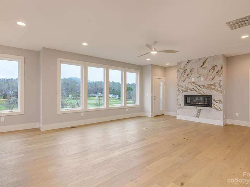 33 Course Drive, Etowah, NC 28729.  MLS# CAR4069124, YatesRealty ID 1248. Banks of windows in living area