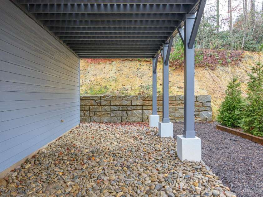 33 Course Drive, Etowah, NC 28729.  MLS# CAR4069124, YatesRealty ID 1248. Hardscaped features surround the home