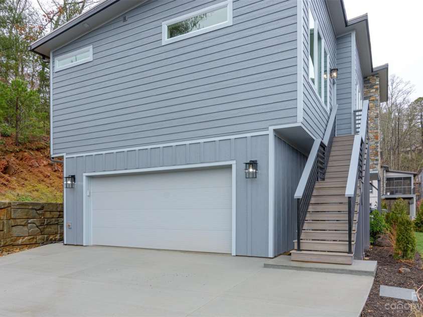 33 Course Drive, Etowah, NC 28729.  MLS# CAR4069124, YatesRealty ID 1248. Side view of two car garage.