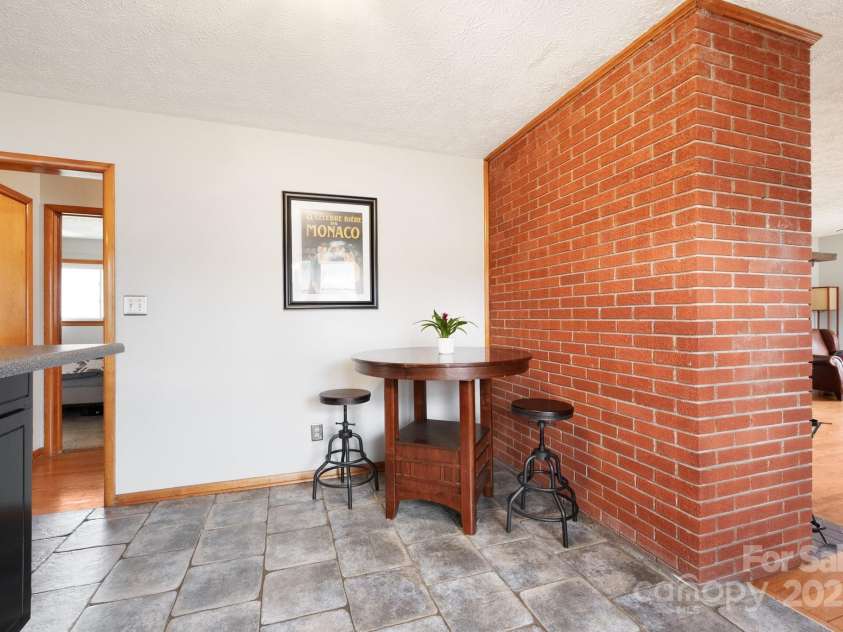 1134 Plott Creek Road, Waynesville, NC 28786.  MLS# CAR4221979, YatesRealty ID 12485. Dining / Breakfast nook area.