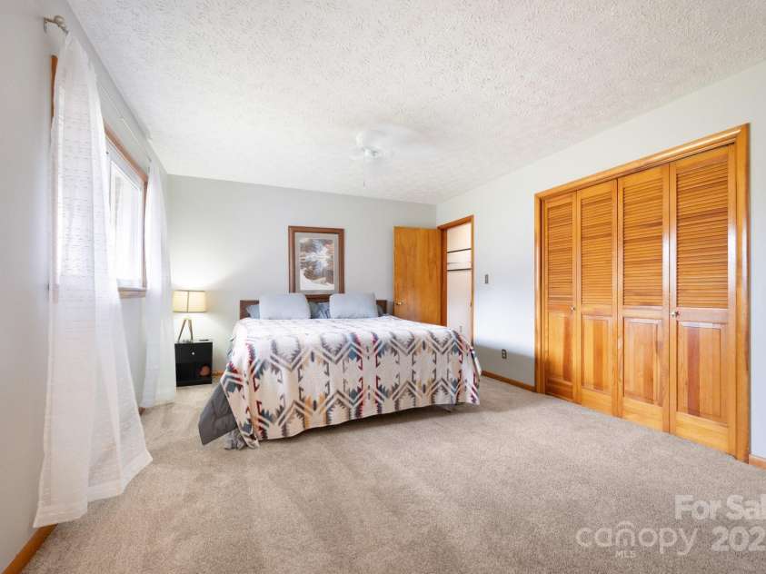1134 Plott Creek Road, Waynesville, NC 28786.  MLS# CAR4221979, YatesRealty ID 12485. Primary Bedroom