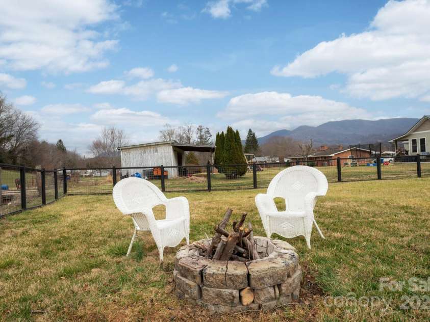 1134 Plott Creek Road, Waynesville, NC 28786.  MLS# CAR4221979, YatesRealty ID 12485. Water and Mtn views!  Creekside fire pit with Mountain Views.
