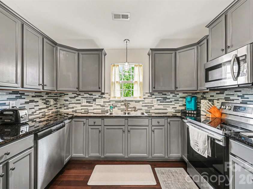 391 Lone Tree Lane, Clover, SC 29710.  MLS# CAR4367245, YatesRealty ID 12487. Refreshed kitchen with backsplash + stone