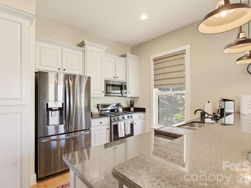 103 Southshore Drive, Tuckasegee, NC 28783.  MLS# CAR4380927, YatesRealty ID 12489. Breakfast bar between kitchen and dining