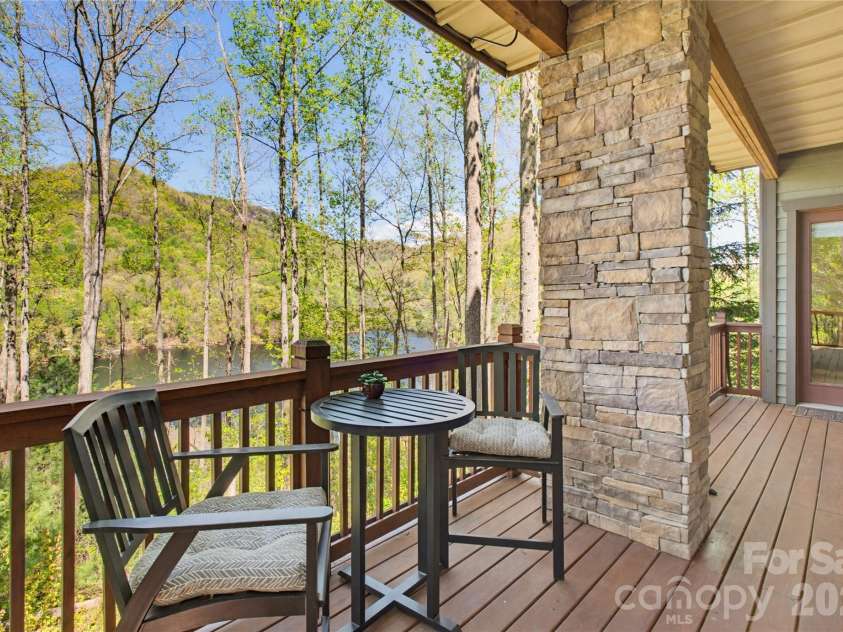 103 Southshore Drive, Tuckasegee, NC 28783.  MLS# CAR4380927, YatesRealty ID 12489. Overlooks Lake from covered porch