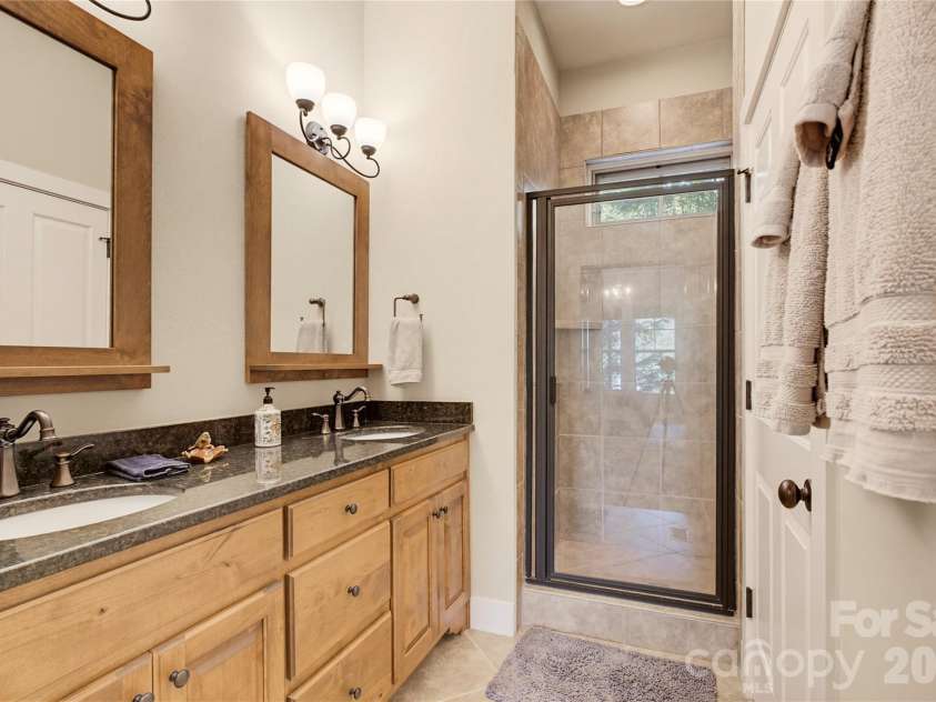 103 Southshore Drive, Tuckasegee, NC 28783.  MLS# CAR4380927, YatesRealty ID 12489. Primary bath with separate water closet