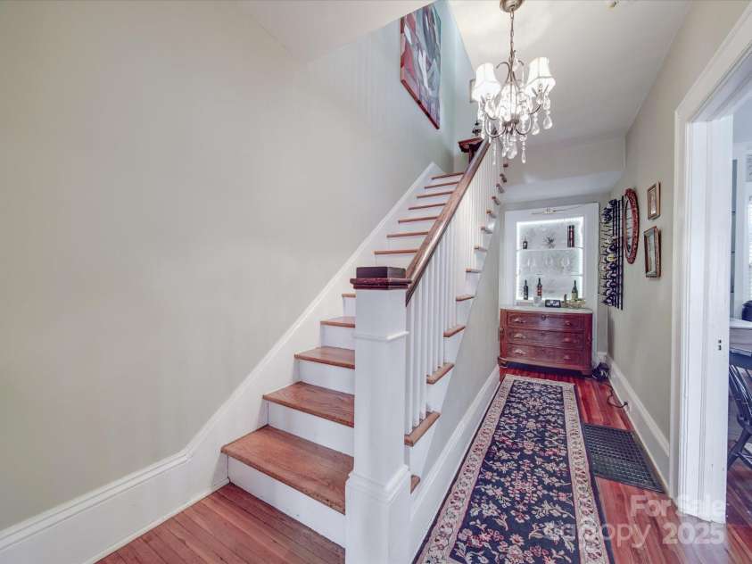 907 Edgewood Circle, Gastonia, NC 28052.  MLS# CAR4255642, YatesRealty ID 12494. Staircase and Built-In Bar/Display Area