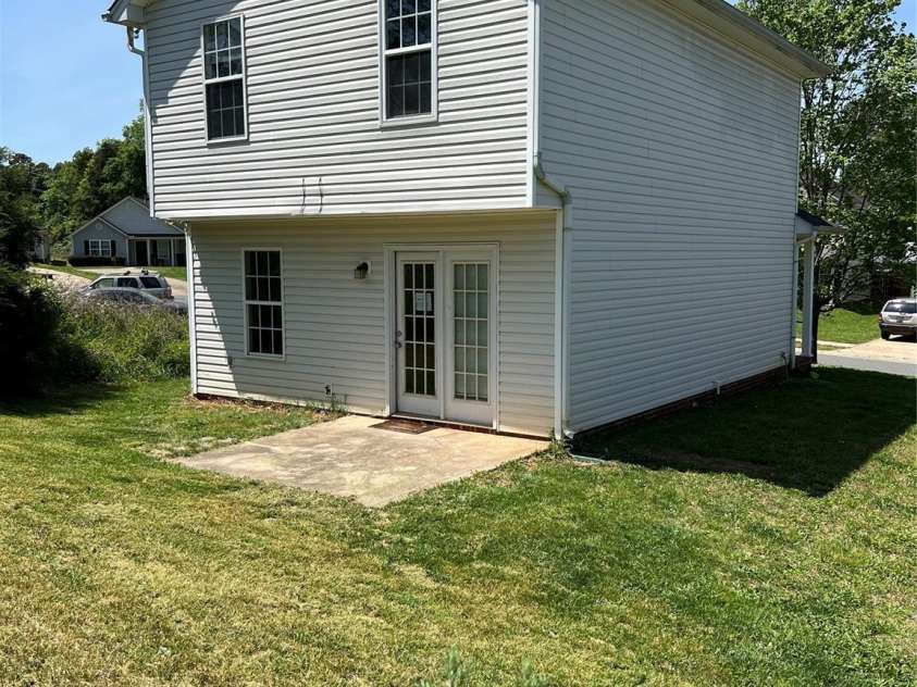 1300 Braveheart Lane, Charlotte, NC 28216.  MLS# CAR4255685, YatesRealty ID 12496. Easy care vinyl siding