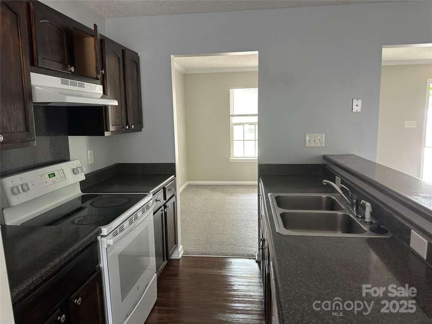 1300 Braveheart Lane, Charlotte, NC 28216.  MLS# CAR4255685, YatesRealty ID 12496. Galley kitchen for efficient use of space