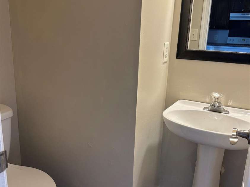 1300 Braveheart Lane, Charlotte, NC 28216.  MLS# CAR4255685, YatesRealty ID 12496. Half bath on the first floor