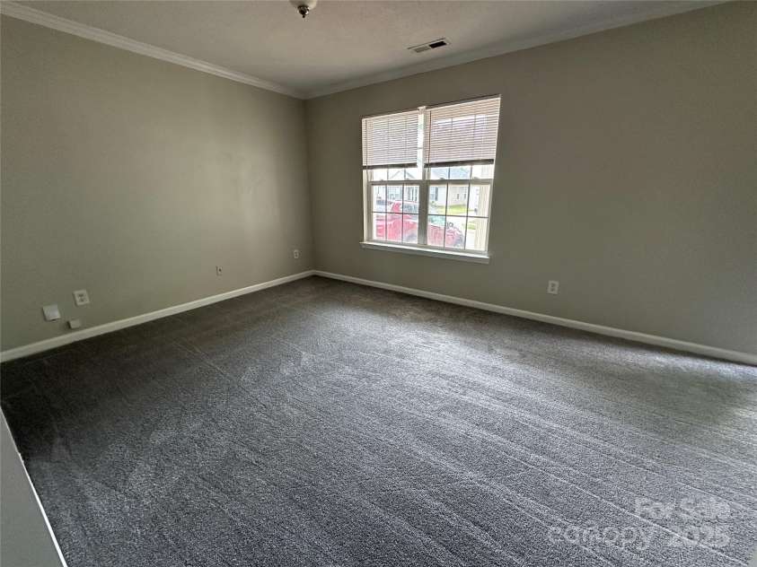 1300 Braveheart Lane, Charlotte, NC 28216.  MLS# CAR4255685, YatesRealty ID 12496. New carpet in the living room