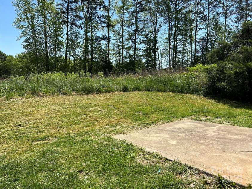 1300 Braveheart Lane, Charlotte, NC 28216.  MLS# CAR4255685, YatesRealty ID 12496. Patio in rear for entertaining