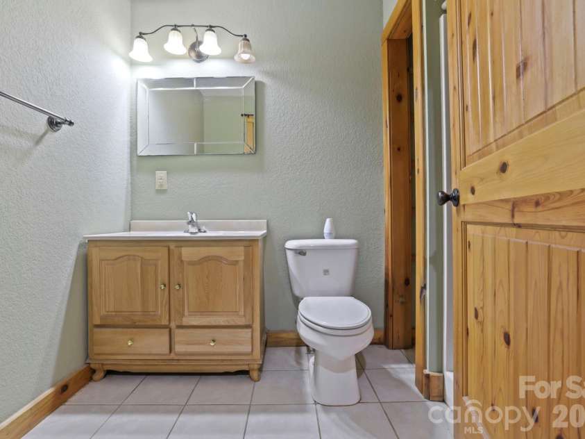 266 Rhododendron Drive, Saluda, NC 28773.  MLS# CAR4367080, YatesRealty ID 12496. Extra bathroom downstairs for added convenience