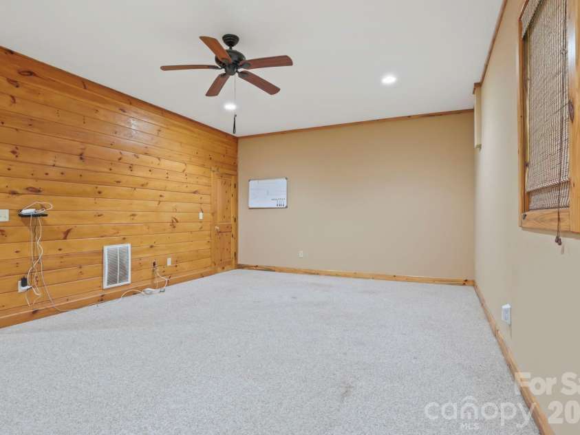 266 Rhododendron Drive, Saluda, NC 28773.  MLS# CAR4367080, YatesRealty ID 12496. Flexible lower-level space with ample room for entertaining, office, or additional living area.