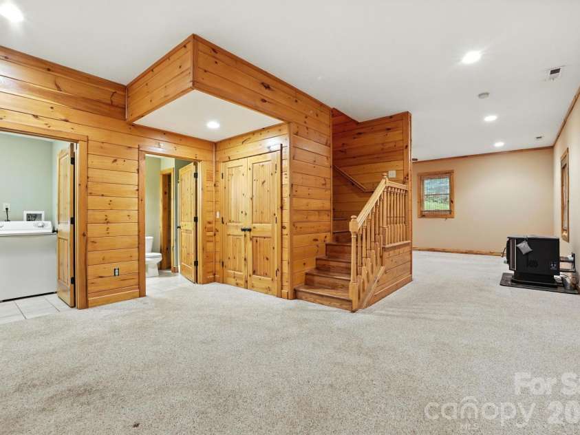 266 Rhododendron Drive, Saluda, NC 28773.  MLS# CAR4367080, YatesRealty ID 12496. Open lower-level layout with easy access to multiple rooms, offering versatility for guests or hobbies.