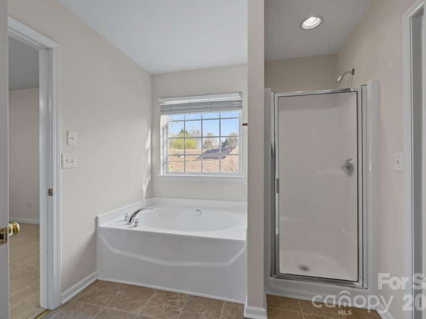 14307 O Casey Lane, Charlotte, NC 28213.  MLS# CAR4355673, YatesRealty ID 12501. Primary Bath with separate shower and soaking tub