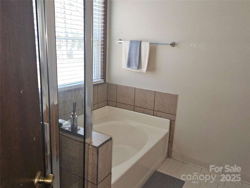 2630 Sloan Drive, Charlotte, NC 28208.  MLS# CAR4228886, YatesRealty ID 12517. Primary bath