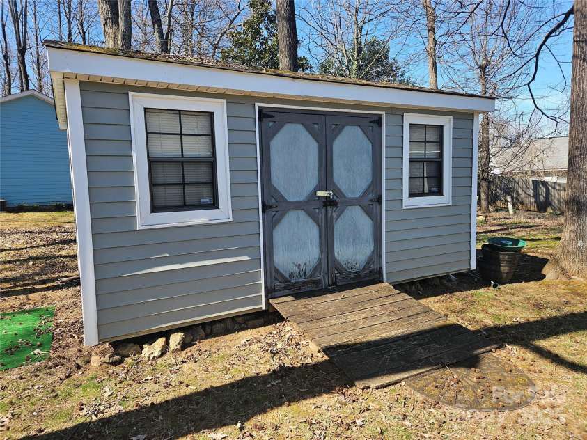 2630 Sloan Drive, Charlotte, NC 28208.  MLS# CAR4228886, YatesRealty ID 12517. Storage shed