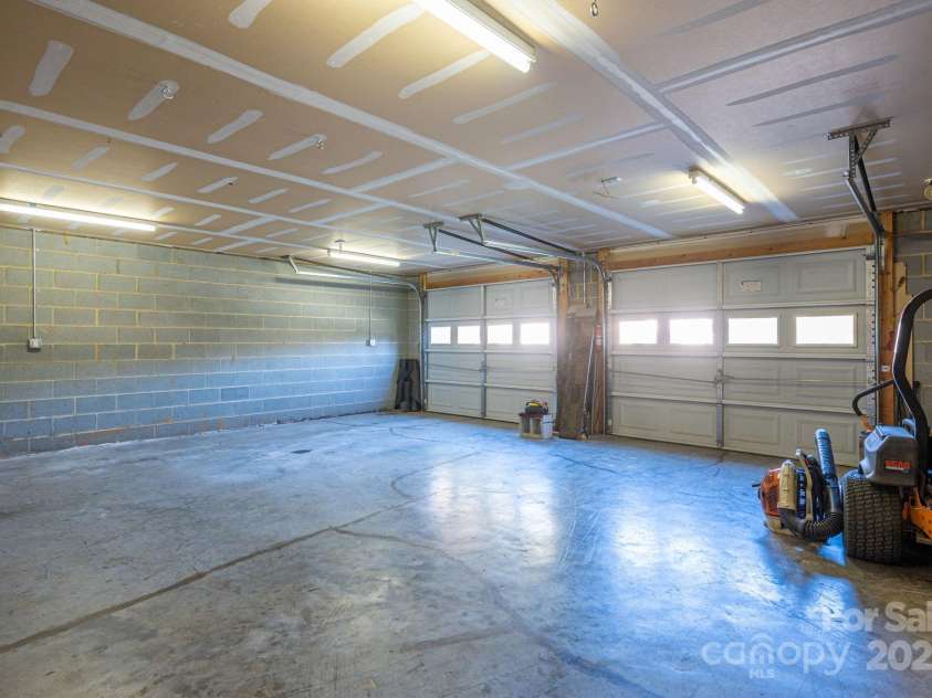 7522 Turnberry Lane, Stanley, NC 28164.  MLS# CAR4321686, YatesRealty ID 1252. Lower Garage