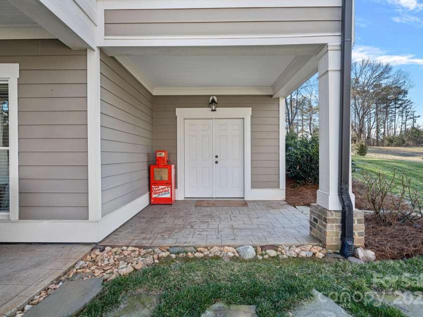 15015 NC Hwy 73 Highway, Huntersville, NC 28078.  MLS# CAR4226627, YatesRealty ID 12520. Additional covered patio space with storage closet for your extras