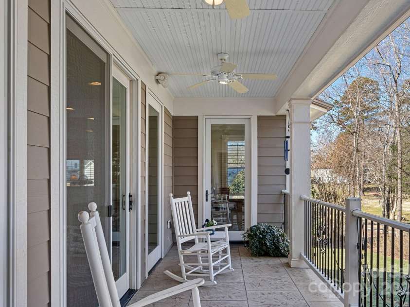 15015 NC Hwy 73 Highway, Huntersville, NC 28078.  MLS# CAR4226627, YatesRealty ID 12520. Covered balcony with lake views, accessed from either living room, dining room, or primary bedroom!