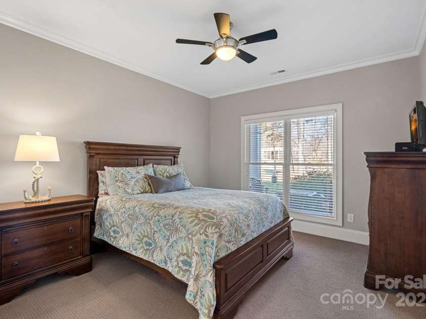 15015 NC Hwy 73 Highway, Huntersville, NC 28078.  MLS# CAR4226627, YatesRealty ID 12520. Guest bedroom #1 with lake views and access to shared full bathroom