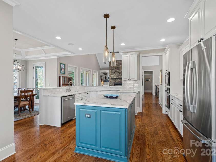 15015 NC Hwy 73 Highway, Huntersville, NC 28078.  MLS# CAR4226627, YatesRealty ID 12520. Newly renovated gourmet kitchen with SS appliances, quartz countertops, large island, and breakfast bar....open to the dining and living areas with lake views!