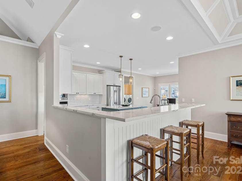 15015 NC Hwy 73 Highway, Huntersville, NC 28078.  MLS# CAR4226627, YatesRealty ID 12520. Newly renovated gourmet kitchen with SS appliances, quartz countertops, large island, and breakfast bar....open to the dining and living areas with lake views!