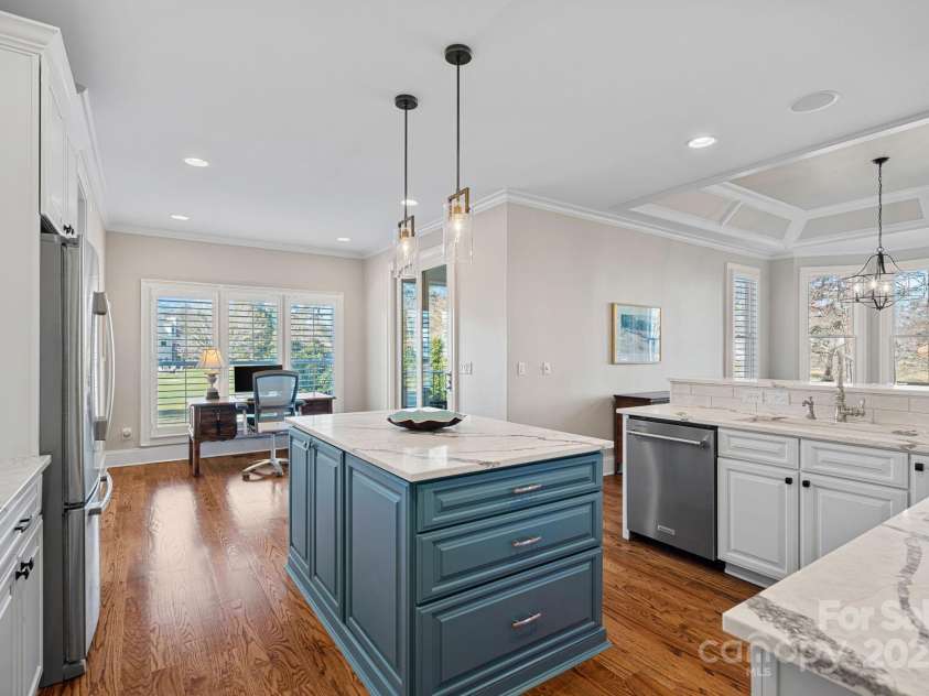 15015 NC Hwy 73 Highway, Huntersville, NC 28078.  MLS# CAR4226627, YatesRealty ID 12520. Newly renovated gourmet kitchen with SS appliances, quartz countertops, large island, and breakfast bar....open to the dining and living areas with lake views!