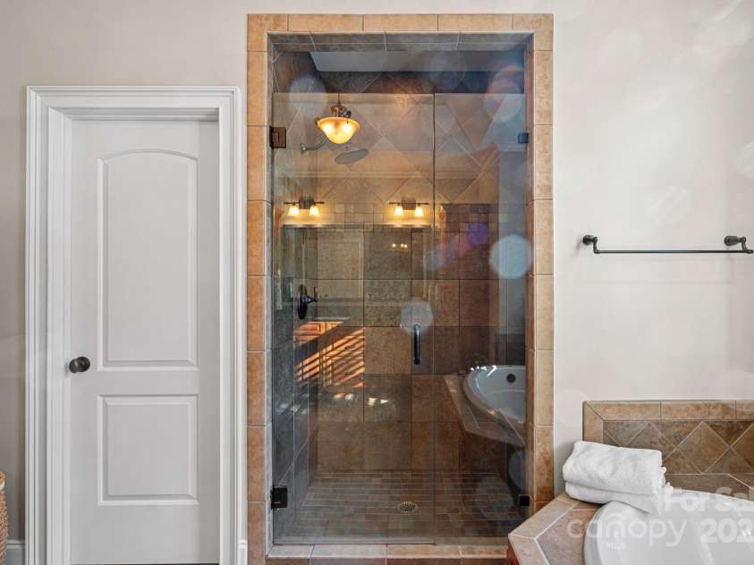 15015 NC Hwy 73 Highway, Huntersville, NC 28078.  MLS# CAR4226627, YatesRealty ID 12520. Rimary ensuite with large, walk-in shower, garden tub, beautiful custom cabinetry