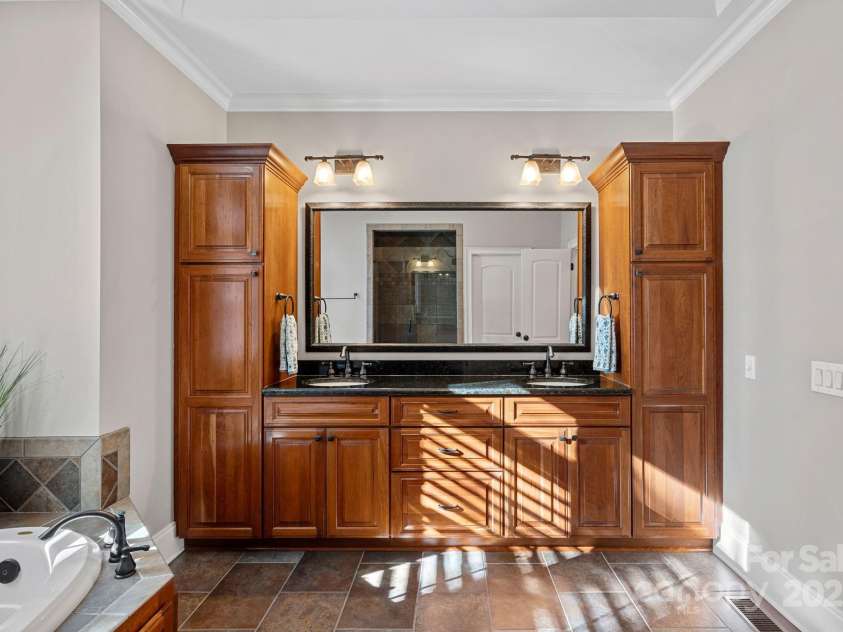 15015 NC Hwy 73 Highway, Huntersville, NC 28078.  MLS# CAR4226627, YatesRealty ID 12520. Rimary ensuite with large, walk-in shower, garden tub, beautiful custom cabinetry