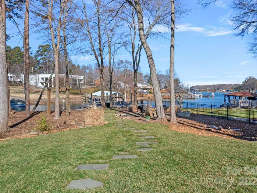 15015 NC Hwy 73 Highway, Huntersville, NC 28078.  MLS# CAR4226627, YatesRealty ID 12520. Walking path to fire pit and dock