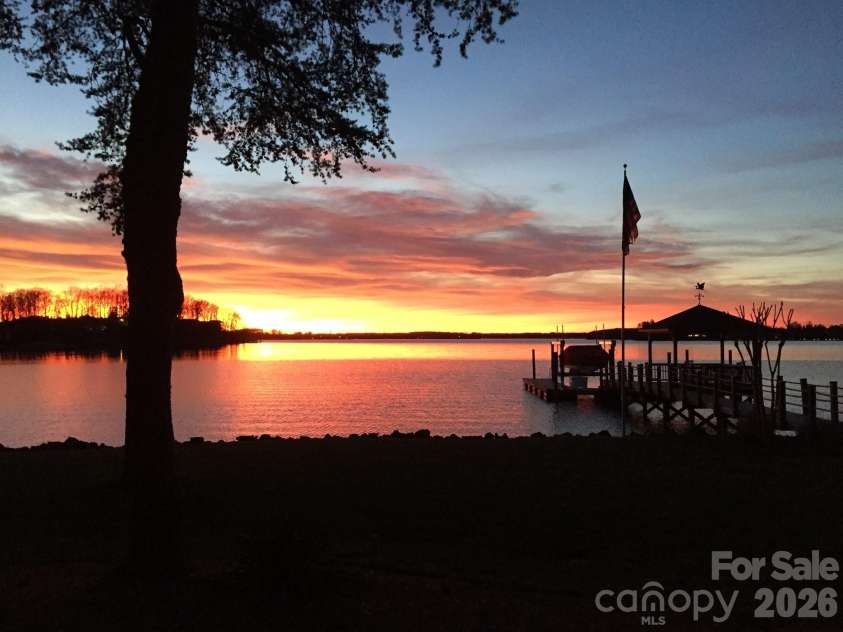 17821 Carlow Road, Cornelius, NC 28031.  MLS# CAR4364716, YatesRealty ID 12527. Winter sunset from backyard!