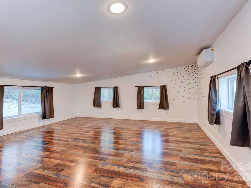 89 Flynn Branch Road, Asheville, NC 28804.  MLS# CAR4198196, YatesRealty ID 12530. Extra large loft previously used as a bedroom, but can also function as play space or office.