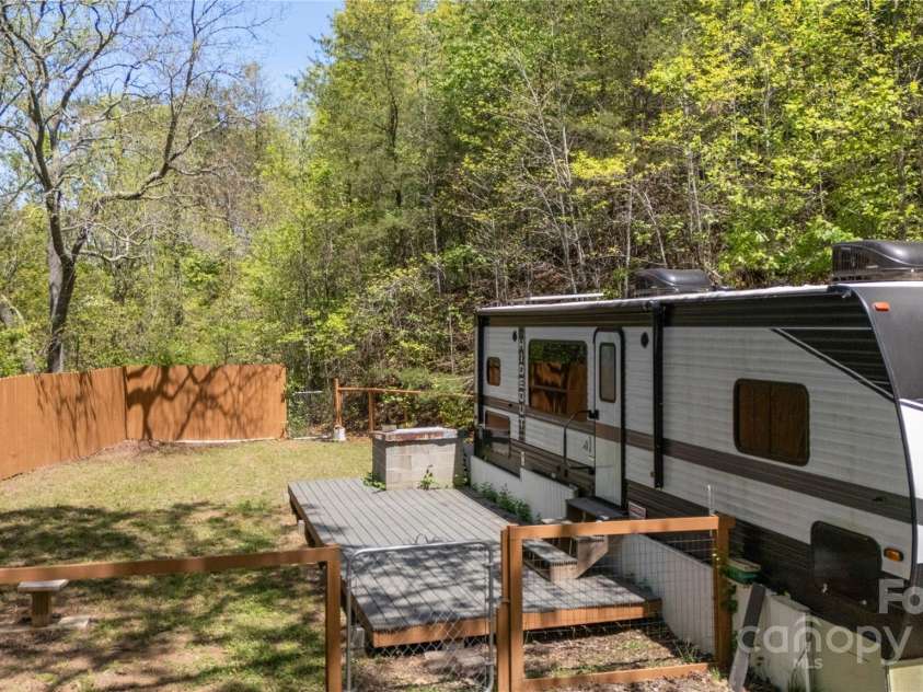 89 Flynn Branch Road, Asheville, NC 28804.  MLS# CAR4198196, YatesRealty ID 12530. Level fenced yard at RV site (RV sold separately)