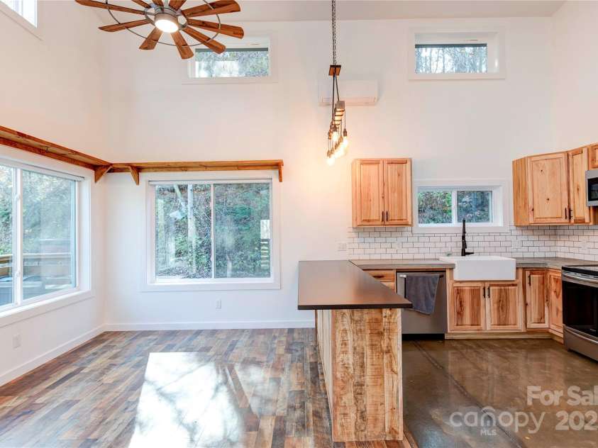 89 Flynn Branch Road, Asheville, NC 28804.  MLS# CAR4198196, YatesRealty ID 12530. Open space for entertaining