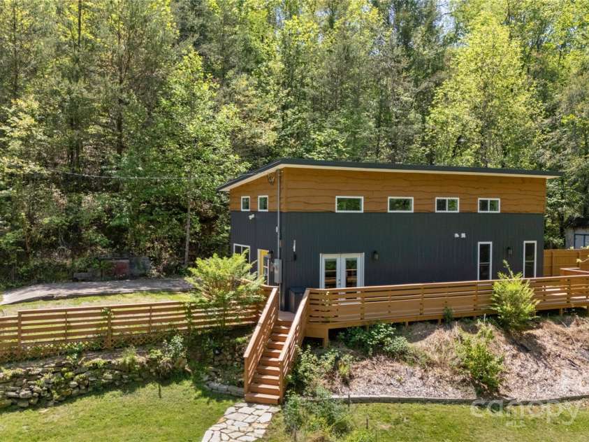 89 Flynn Branch Road, Asheville, NC 28804.  MLS# CAR4198196, YatesRealty ID 12530. Side view of main home from shipper