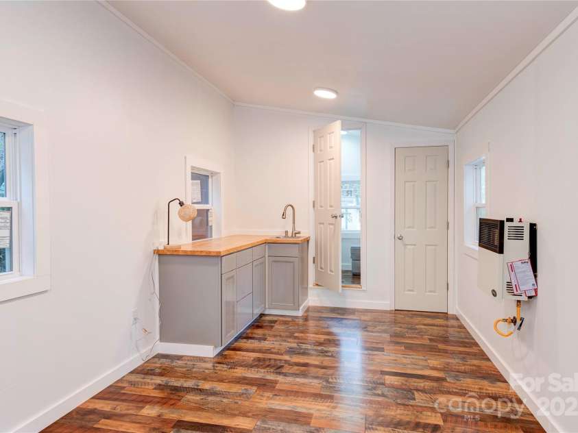 89 Flynn Branch Road, Asheville, NC 28804.  MLS# CAR4198196, YatesRealty ID 12530. Studio has heater, wet bar, and composting toilet