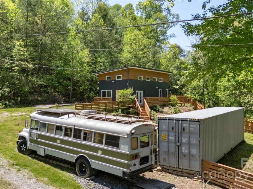 89 Flynn Branch Road, Asheville, NC 28804.  MLS# CAR4198196, YatesRealty ID 12530. Tiny home bus is the cherry on top