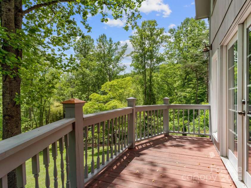 116 Sams Branch Road, Candler, NC 28715.  MLS# CAR4137587, YatesRealty ID 1254. Primary bedroom deck 