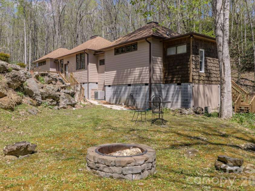 426 Cook Town Road, Bakersville, NC 28705.  MLS# CAR4371118, YatesRealty ID 12540. Side yard