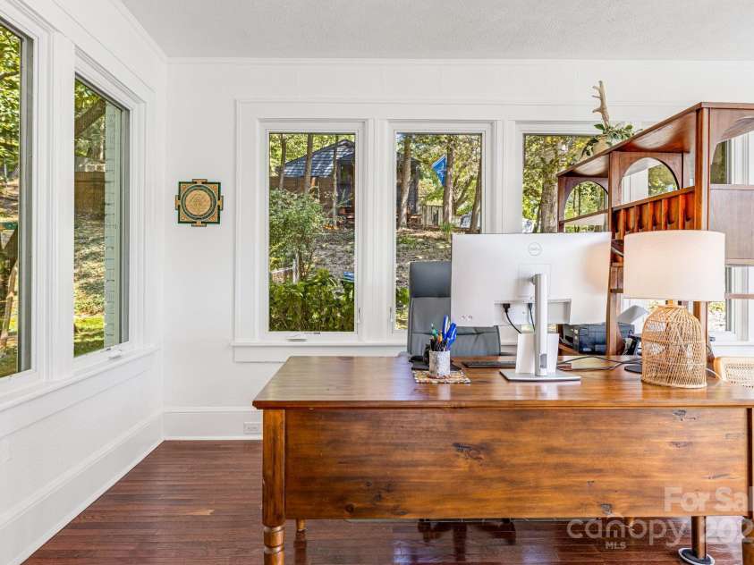 18 Robinwood Avenue, Asheville, NC 28806.  MLS# CAR4217226, YatesRealty ID 12548. Conditioned Sunroom is Surrounded by Nature
